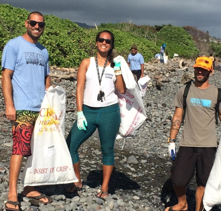 Hawaiian Paddle Sports Employees Remove Rubbish from Kaehu Beach
