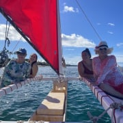 Family sailing on canoe in Maui