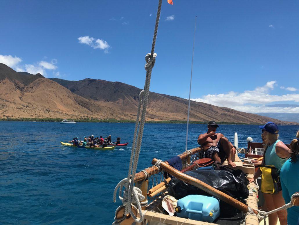 People on outriger canoe