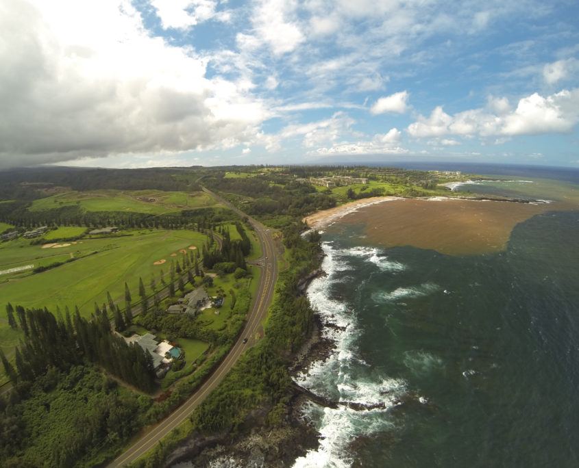 Brown run-off water flowing into the ocean