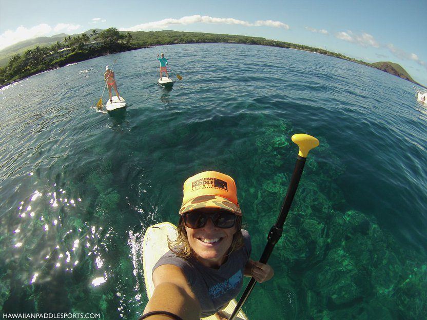 Paddleboarders along island shorelines